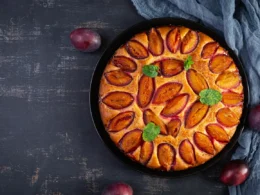 delicious plum cake on wooden background homemade 2023 11 27 05 25 51 utc